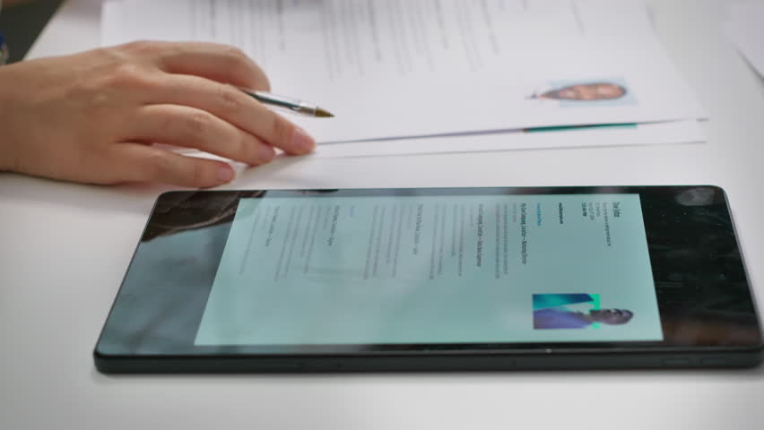 Team of recruiters selecting candidates based on their resumes, looking for the right person to fill in job vacancy. HR staff evaluating the qualifications of applicants after interview. Camera A.