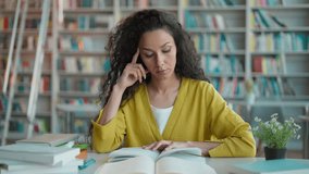 Latin Hispanic woman reading book learning student preparing exam studying tired close textbook break female education university homework academic boredom college contemplation bored girl knowledge - Powered by Shutterstock - Get 15% off with code: PIKWIZARD15