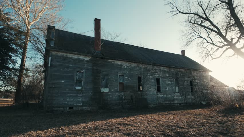 Creepy abandoned building in the midwest at sunset 