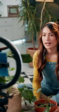 Influencer, smile and woman with plants, ring light and tips for followers in social media, leaves and lounge. Apartment, content creator and girl with advice for gardening, green and love of nature