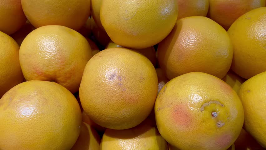 a lot of fruits. market. store. background. citruses. healthy food. natural. food. health. Vegeterian. diet. Orange fruit. Lemon. Yellow lemon.Top view