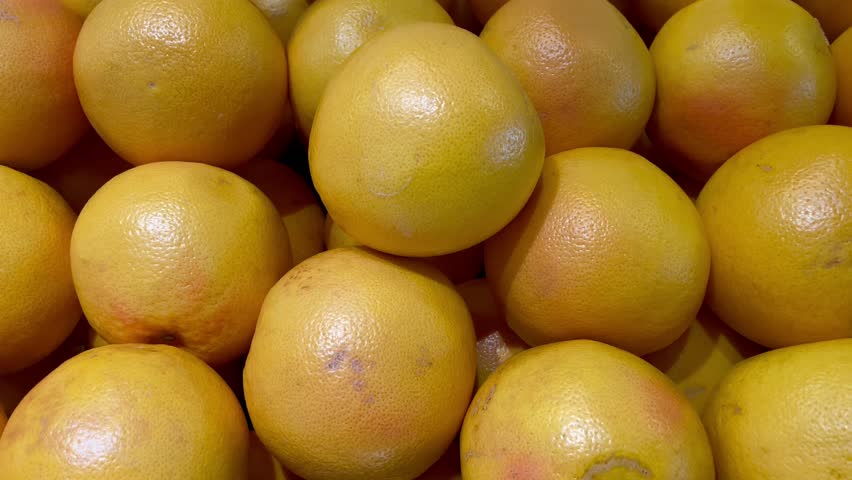 a lot of fruits. market. store. background. citruses. healthy food. natural. food. health. Vegeterian. diet. Orange fruit. Lemon. Yellow lemon.Top view