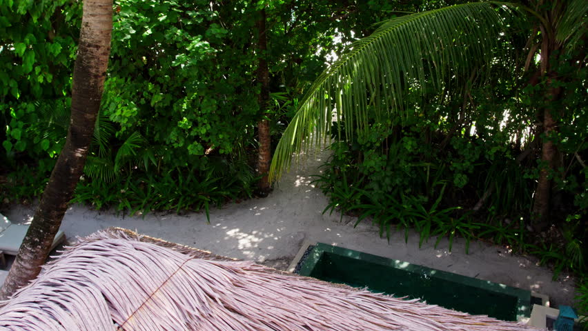 Girl walks around a hotel in the Maldives