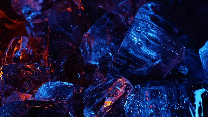 Ice cube on color fire light. abstract wallpaper