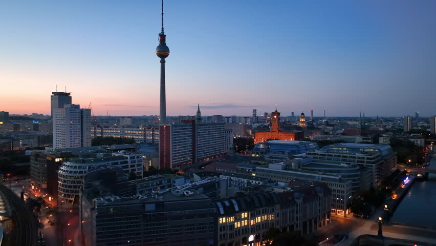 Aerial view of famous places architectural landmarks TV Tower and Berlin Cathedral, Alexanderplatz at night. Drone flight above City of Berlin, Germany