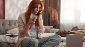 Caucasian woman girl female at bedroom mobile phone smartphone talk argue conflict quarrel argument problem call travel agency canceled flight passport tickets trouble prepare trip journey vacation - Powered by Shutterstock - Get 15% off with code: PIKWIZARD15