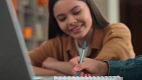 Happy Caucasian two friends students teens girl guy woman female unrecognizable man male classmates studying together laptop prepare exam learning homework at school university college study computer - Powered by Shutterstock - Get 15% off with code: PIKWIZARD15