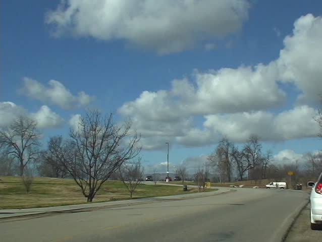 time lapse at park with blue sky and clouds