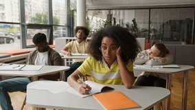 University high school students college lecture class lesson sad boring African American guys males men boys Caucasian girls women females ladies boredom suffer listening teacher study bored education - Powered by Shutterstock - Get 15% off with code: PIKWIZARD15