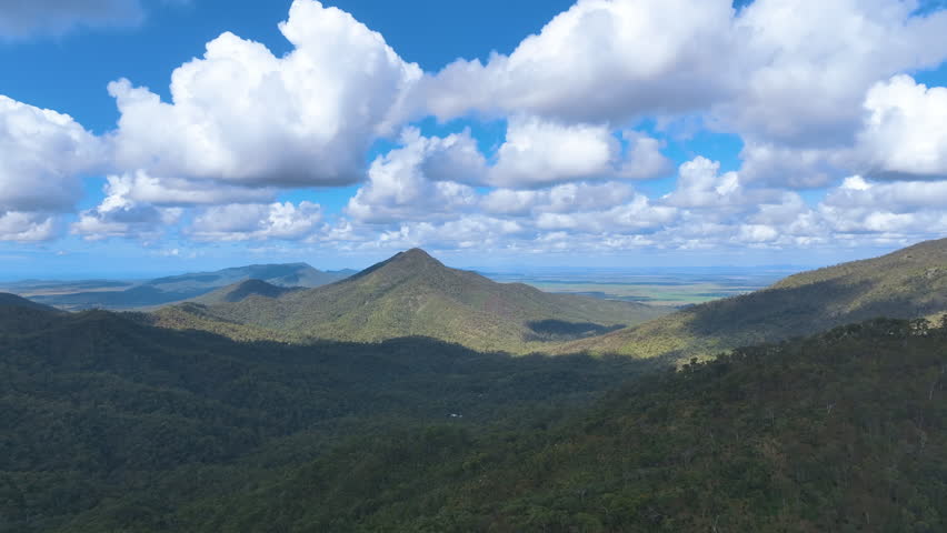Aerial tracks across the lush sub tropical valleys and hills of Rockhampton