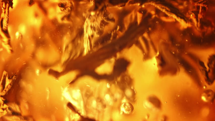 Tea Leaves, Soaked With Water And Unfurled, Swirl, Mixing Flavors And Aromas in Macro and Slow Motion