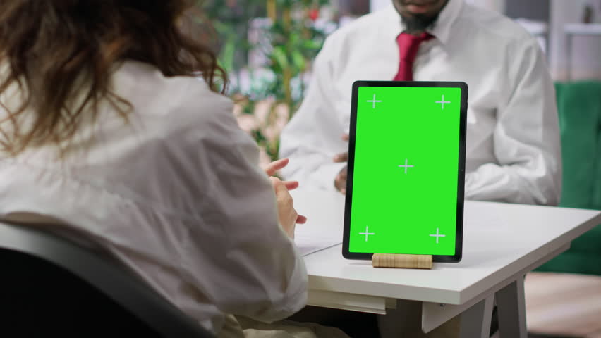 Interviewer and candidate meeting for an interview next to green screen, HR manager asking questions about qualifications and business administration expertise. Recruitment process. Camera A.