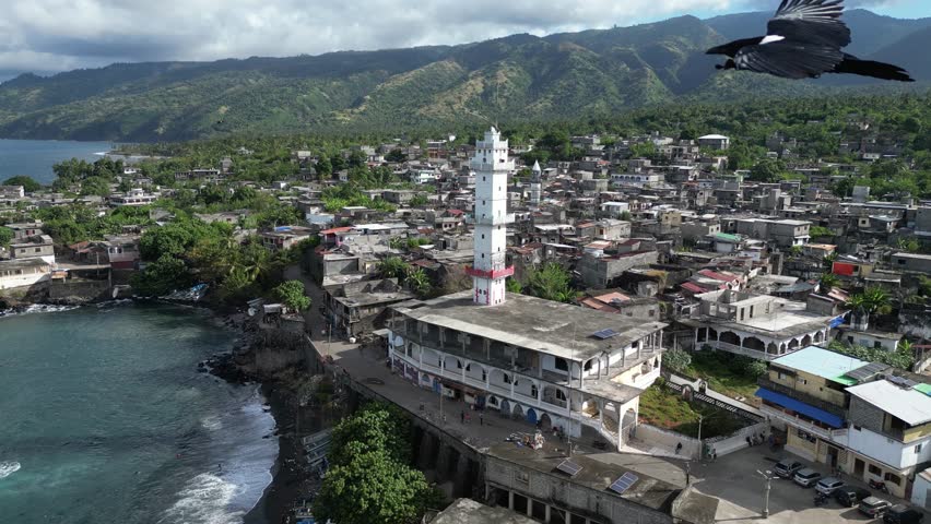 Aerial scenic footage drone rotate around old historical white mosque muslim in Domoni Anjouan volcanic island in the Comoro Indian Ocean