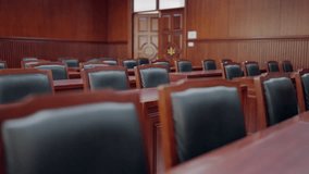 A room with black chairs and a wooden table - Powered by Shutterstock - Get 15% off with code: PIKWIZARD15