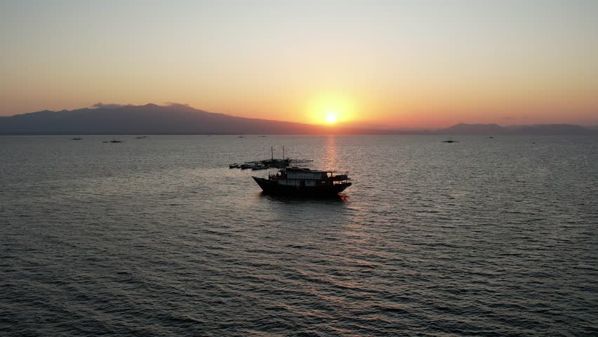 Bautiful sunrise at labuan jambu, lombok, from sailing boat