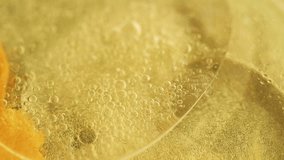 Oil drop paint. Golden glitter. Defocused yellow color translucent shimmer liquid shiny sequin particles light texture flow motion abstract art background - Powered by Shutterstock - Get 15% off with code: PIKWIZARD15