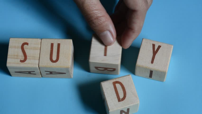 STUDY word written on wood block. Content text on wooden table for your desing, concept.