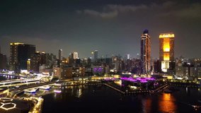 This aerial shot captures Kaohsiung's Love River at night, with the vibrant skyline and nearby pier, showcasing the city’s modern architectural beauty against the river's reflections. - Powered by Shutterstock - Get 15% off with code: PIKWIZARD15