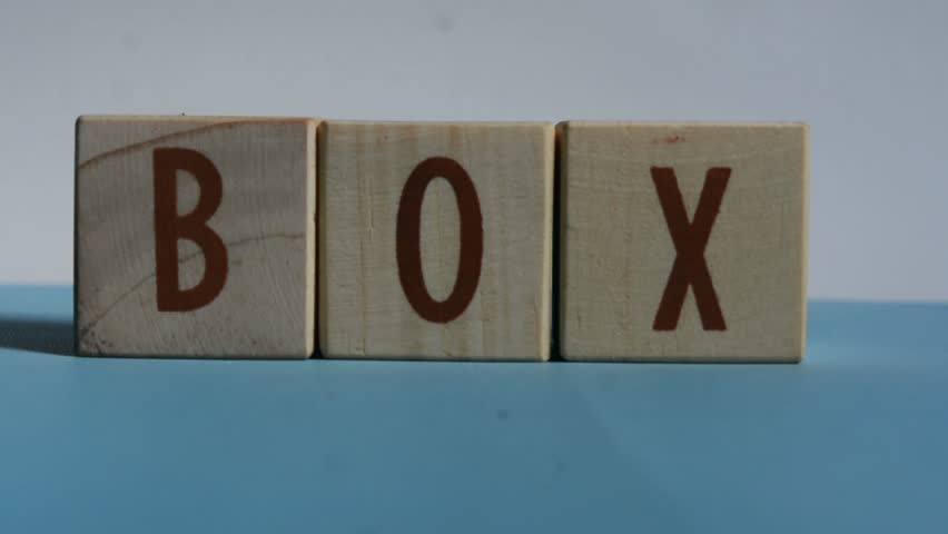 BOX word written on wood block. Content text on wooden table for your desing, concept.