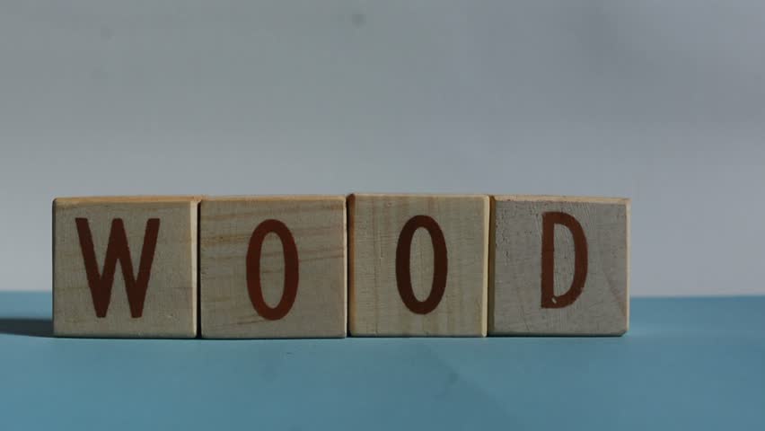WOOD word written on wood block. Content text on wooden table for your desing, concept.