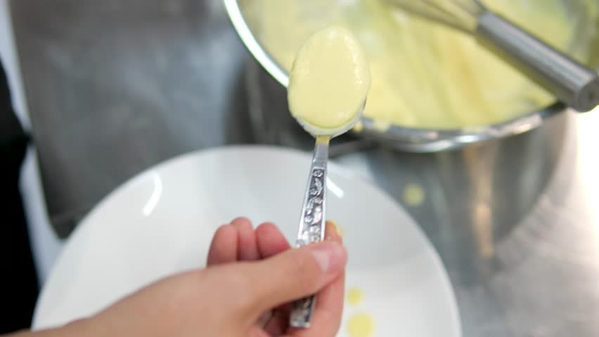 Egg benedict with hollandaise sauce cooking video cook eggs benedict poached egg pour sauce on sandwich