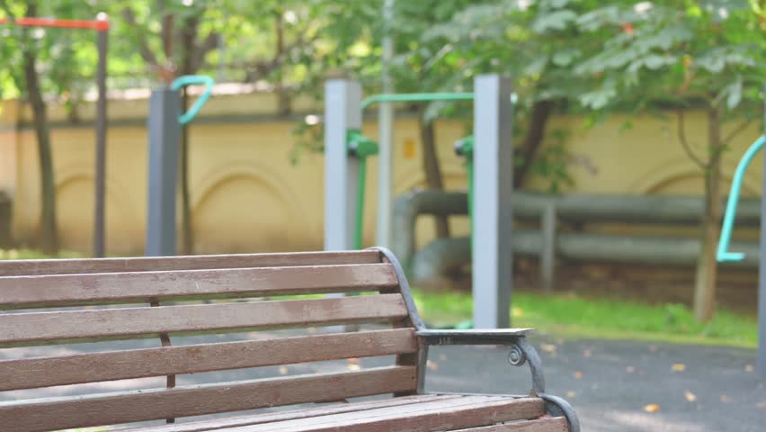 Middle Aged Man Coming and Sitting Outdoor on Bench
