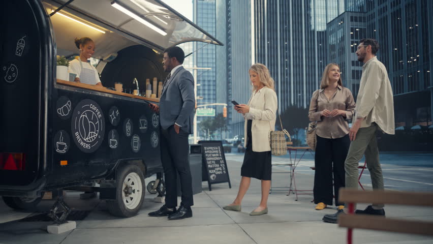 Diverse People Queuing on a Modern City Street to Order Delicious Coffee from a Small Food and Drinks Stall. Young African American Female Serving Customers and Making Refreshing Drinks To Go