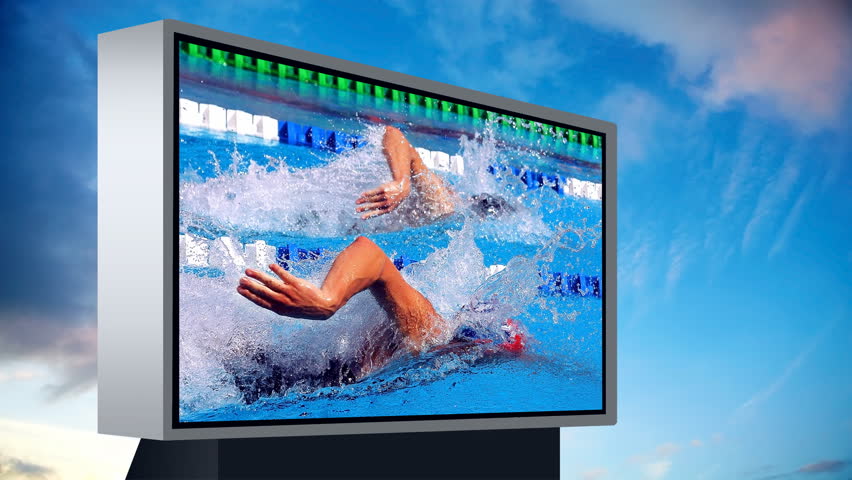 Monitor with swimming sport under Timelapse view of sky