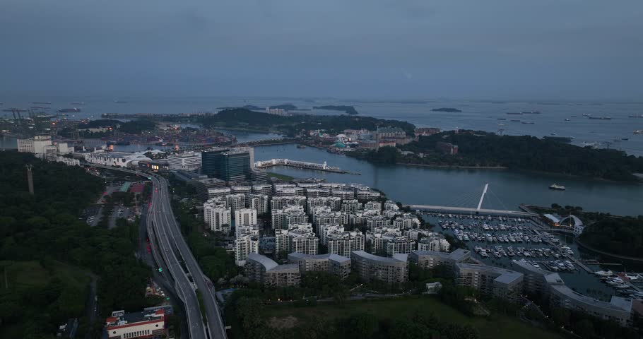 Singapore Keppel bay, cruise bay and city view. Sentosa island. Aerial video at night and dusk.