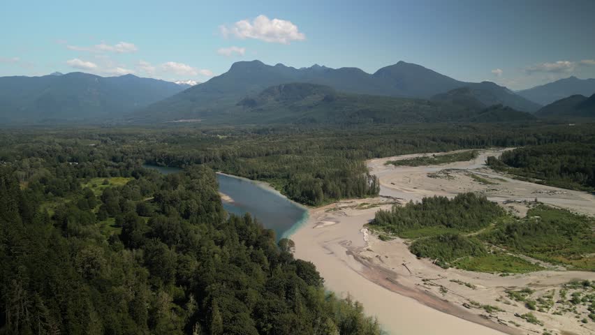 Aerial of confluence of Skagit and Sauk rivers in Washington mountains in summer