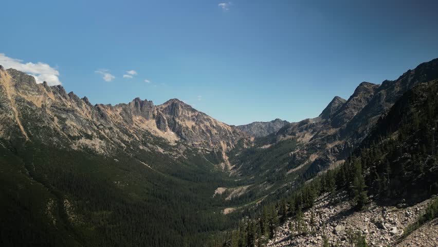 Aerial looking down valley in North Cascade mountains on Washington Pass in summer