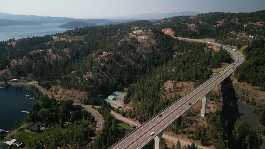Aerial of elevated bridge on highway 90 next to lake Coeur Dalene in northern Idaho in summer