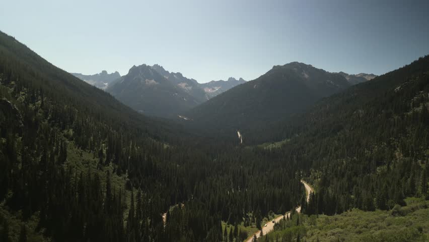 Aerial of Highway 20 through North Cascade Mountains in northern Washington in summer
