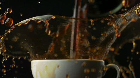 Coffee over-spilled in cup shooting with high speed camera, phantom flex.
