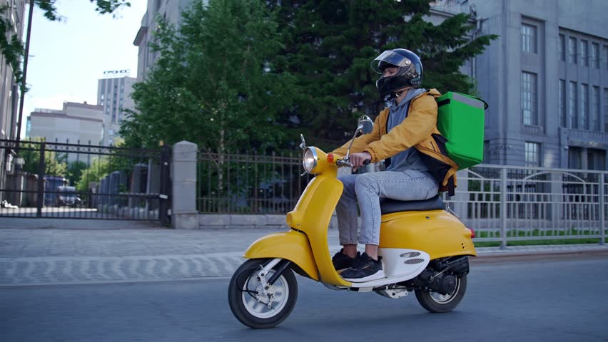 Courier man carry package moped. Guy ride scooter city street deliver box. Green backpack mock up. Fast food delivery service. Person drive bike thermal store bag. Express home order. Rush rider hurry