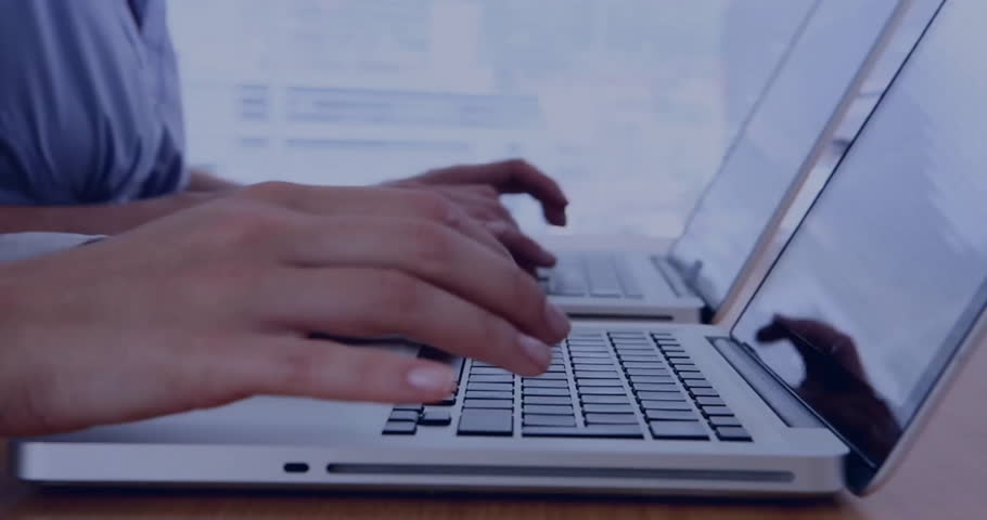 Animation of social media icons with speech bubbles over diverse colleagues using laptops. Global social media, computing, communication and digital interface concept digitally generated video.