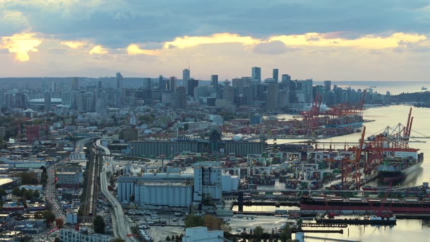 Aerial view of Port of Vancouver, harbour and mountains on the background