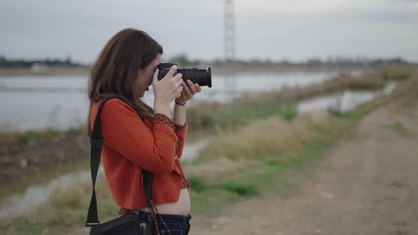 Arrogant photographer taking pictures of something