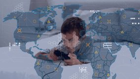 Animation of world map with data processing over biracial boy playing video games. Global finances, computing, lifestyle and digital interface concept digitally generated video. - Powered by Shutterstock - Get 15% off with code: PIKWIZARD15