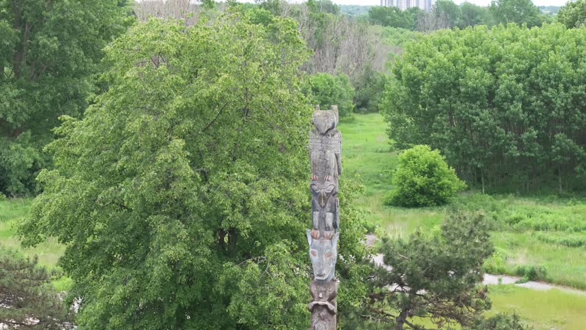 Aerial view of cedar log totem pole at Belle Park in Kingston Ontario Limestone City Canada carved by Native Brotherhood members