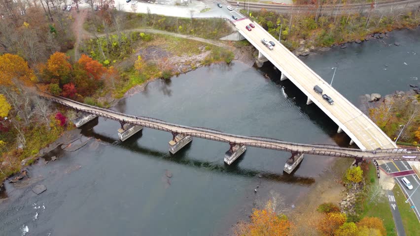Great allegheny passage walking bridge over river in Ohiopyle Falls in the Fall. Ohiopyle State Park in Pennsylvania. Ohiopyle in Pennsylvania on the Youghiogheny river in early fall. Aerial view