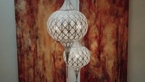 Intricate Moroccan lamps with warm, ambient lighting and abstract fiery red background - Powered by Shutterstock - Get 15% off with code: PIKWIZARD15