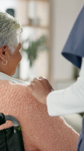 Back, senior care and hand on woman shoulder for support, trust or empathy in nursing home. Elderly person with disability, smile or caregiver in living room for comfort, check or wheelchair for help