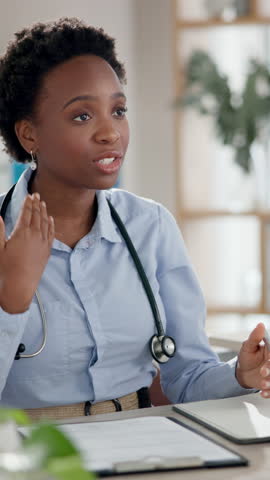 Black woman, doctor and consultation or discussion at office for explaining, advice and symptoms. Female person, specialist and cardiologist with paperwork and contract for surgery agreement