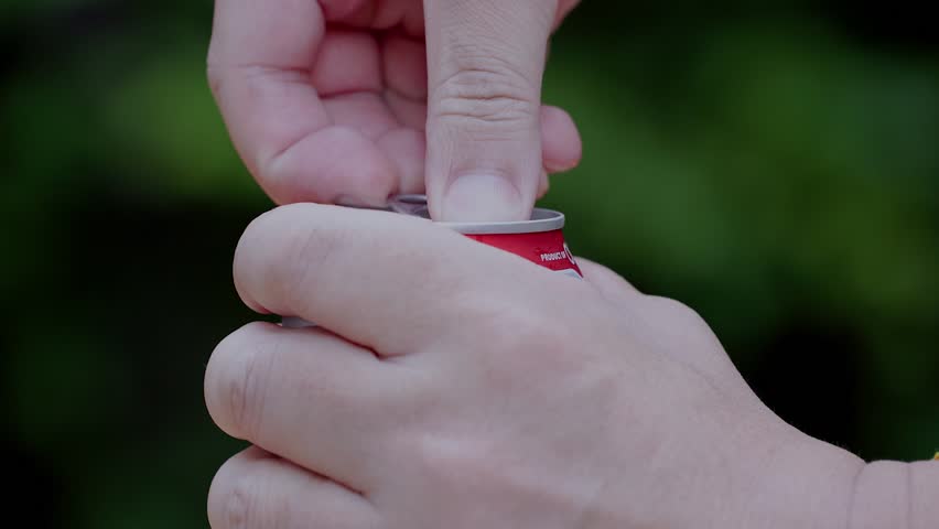 Photography for dynamic scenes, burst, foam erupts from the top of the can as it