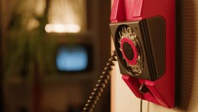 Retro vintage phone, red rotary telephone is displayed on a wooden desk, adding a nostalgic touch - Powered by Shutterstock - Get 15% off with code: PIKWIZARD15