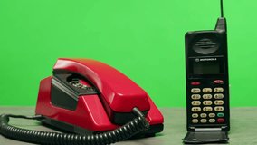 Retro vintage phone on chroma key green screen, rotary telephone is displayed on a wooden desk, adding a nostalgic touch - Powered by Shutterstock - Get 15% off with code: PIKWIZARD15