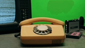 Retro vintage phone on chroma key green screen, rotary telephone is displayed on a wooden desk, adding a nostalgic touch - Powered by Shutterstock - Get 15% off with code: PIKWIZARD15
