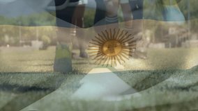 Animation of flag of argentina over diverse rugby players practicing on field. Global sports, competition, connections, computing and data processing concept digitally generated video. - Powered by Shutterstock - Get 15% off with code: PIKWIZARD15