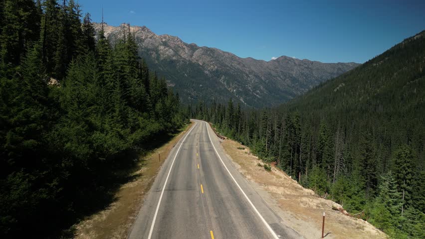Low aerial over Highway 20 in Okanogan National Forest in North Cascade Mountains
